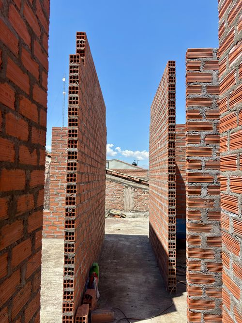 Free A view of brick walls under construction on a clear day in Ayacucho, Peru. Stock Photo