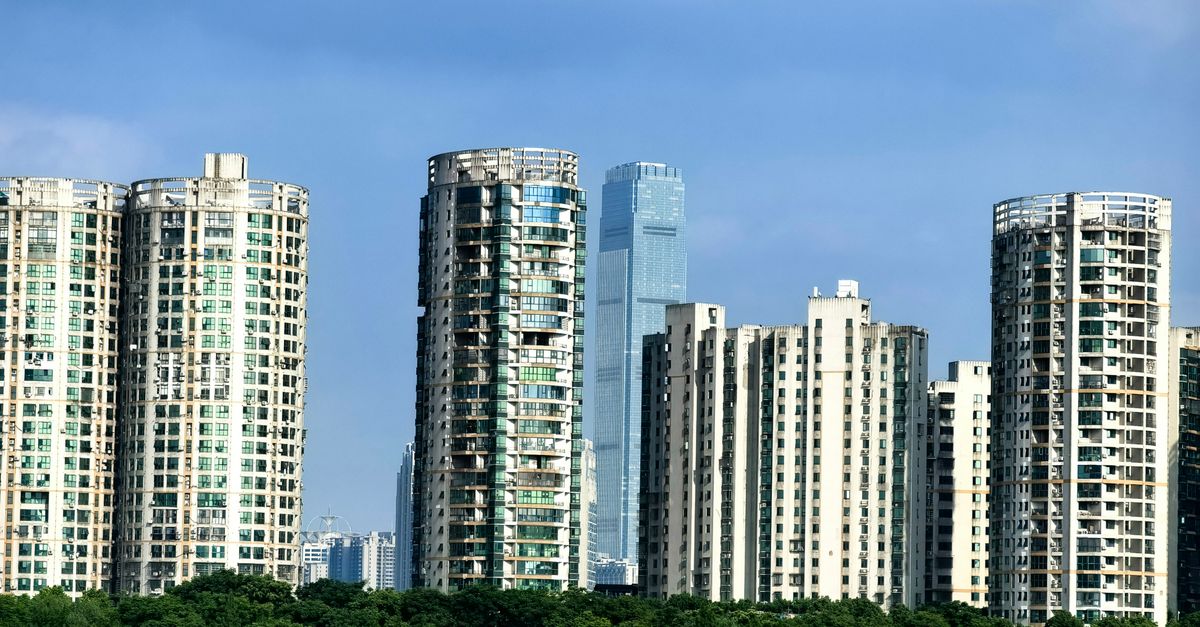Panoramic view of Changsha's urban skyline showcasing modern high-rise buildings against a blue sky.