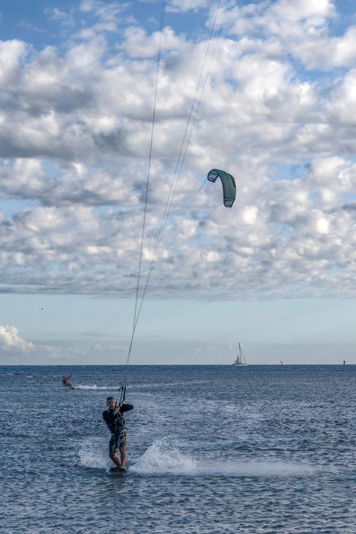 Free Experience thrilling kitesurfing against the stunning New Caledonia seascape. Stock Photo