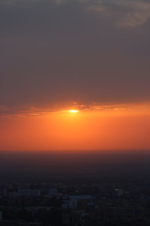 Free Beautiful sunset with vibrant orange hues over Béni Mellal cityscape, Morocco. Stock Photo