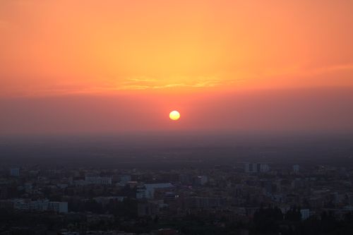 Free Breathtaking sunset view over Béni Mellal cityscape with vibrant colors. Stock Photo
