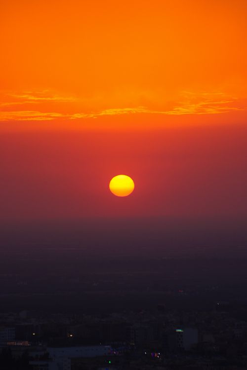 Free Breathtaking sunset over Béni Mellal, Morocco, with vibrant orange hues lighting up the horizon. Stock Photo