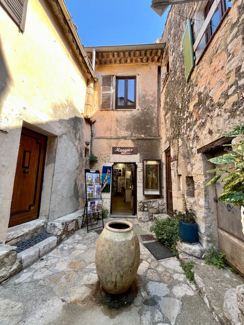 Free Rustic alley in Èze, Provence with stone walls and pottery ambiance. Stock Photo