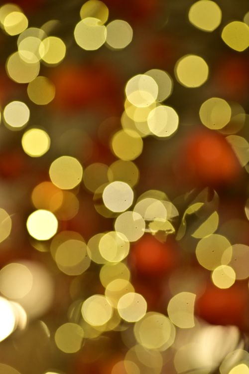 Free A captivating bokeh effect with golden and red tones, perfect for festive and holiday-themed designs. Stock Photo