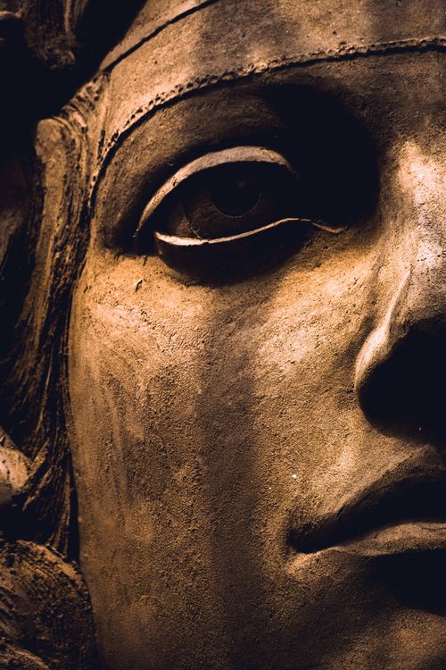 Free Detailed view of an ancient stone sculpture with rich texture and craftsmanship. Stock Photo