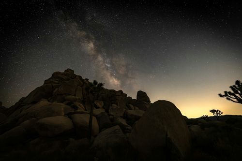 Free Breathtaking view of the Milky Way above desert rocks at night. Stock Photo