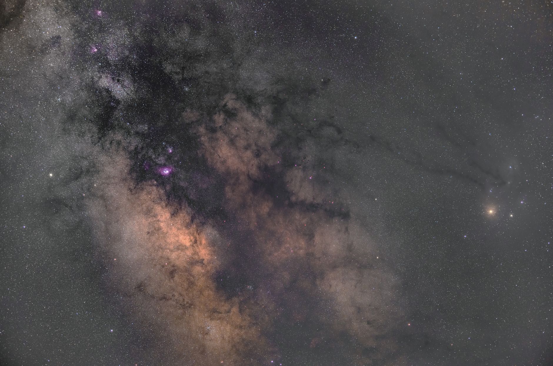 Stunning image of the Milky Way galaxy showcasing star clusters and interstellar clouds.