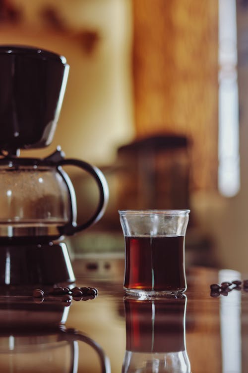 Free Clear Glass Mug With Brown Liquid On A Table Stock Photo