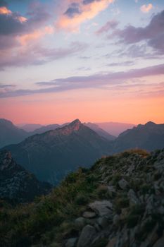Captivating sunset over mountain ranges with colorful sky hues, perfect for nature enthusiasts.