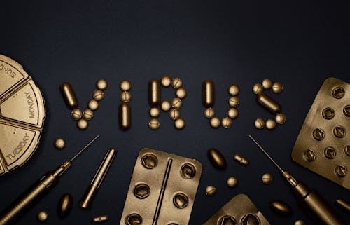 Syringe and Pills on Blue Background