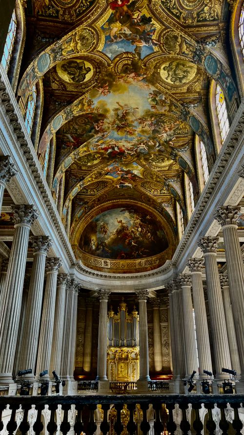 Free Ornate ceiling and columns inside the Chapel of Versailles showcasing exquisite Baroque art. Stock Photo