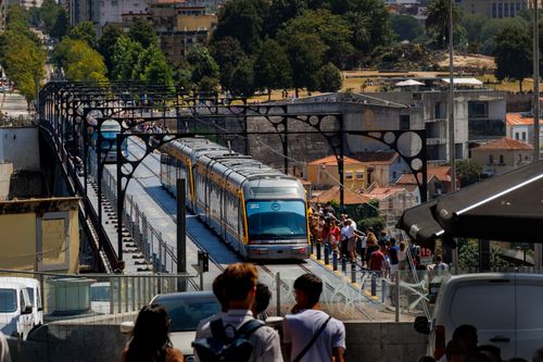 Free A busy metro train on the iconic Dom Luís I Bridge in Porto, Portugal, during the day. Stock Photo