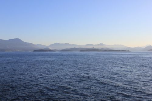 Free Expansive ocean view with mountains in the background on a clear day in British Columbia. Stock Photo