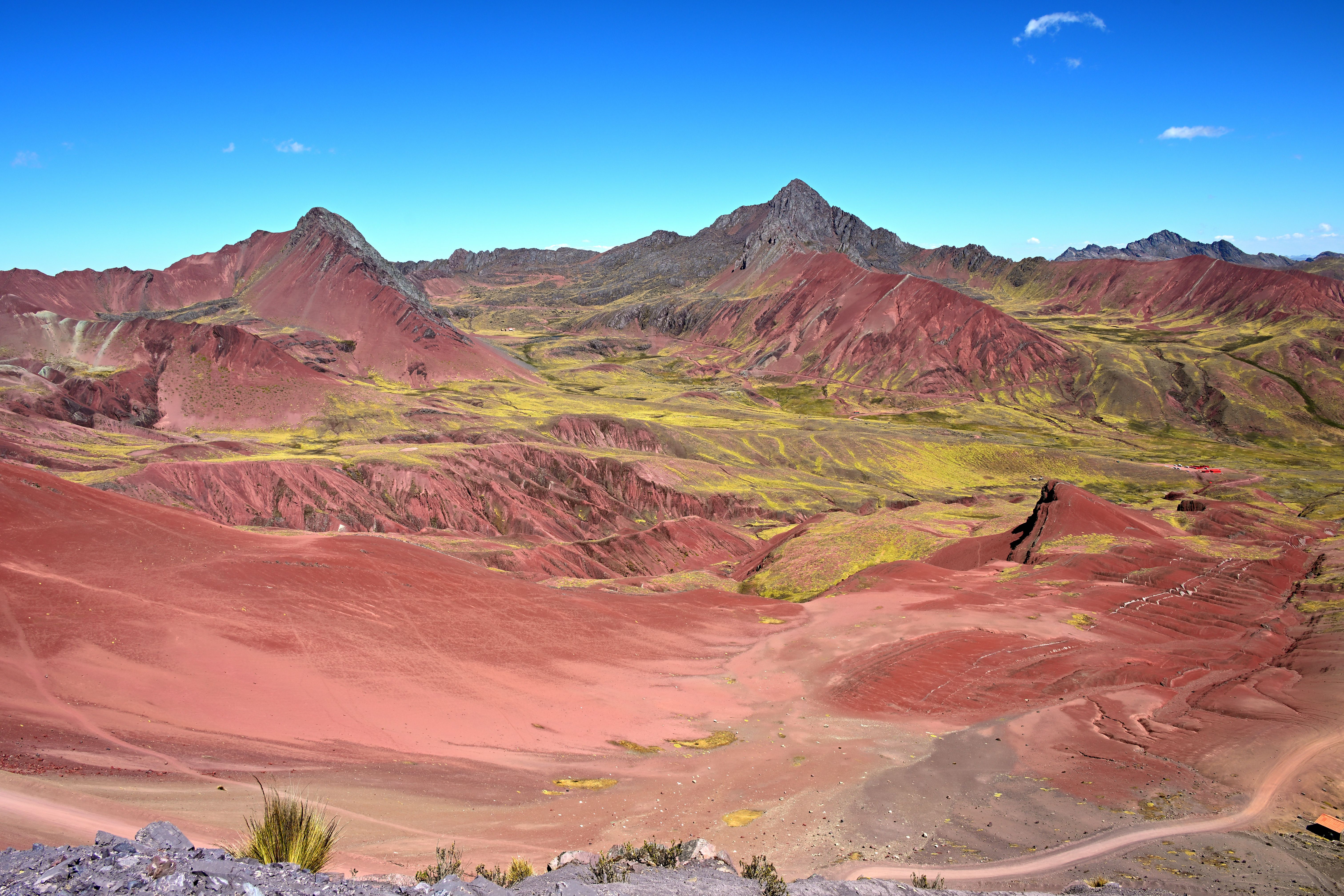 The rust-red slopes of the Red Valley (Valle Rojo) near Vinicunca, Peru
