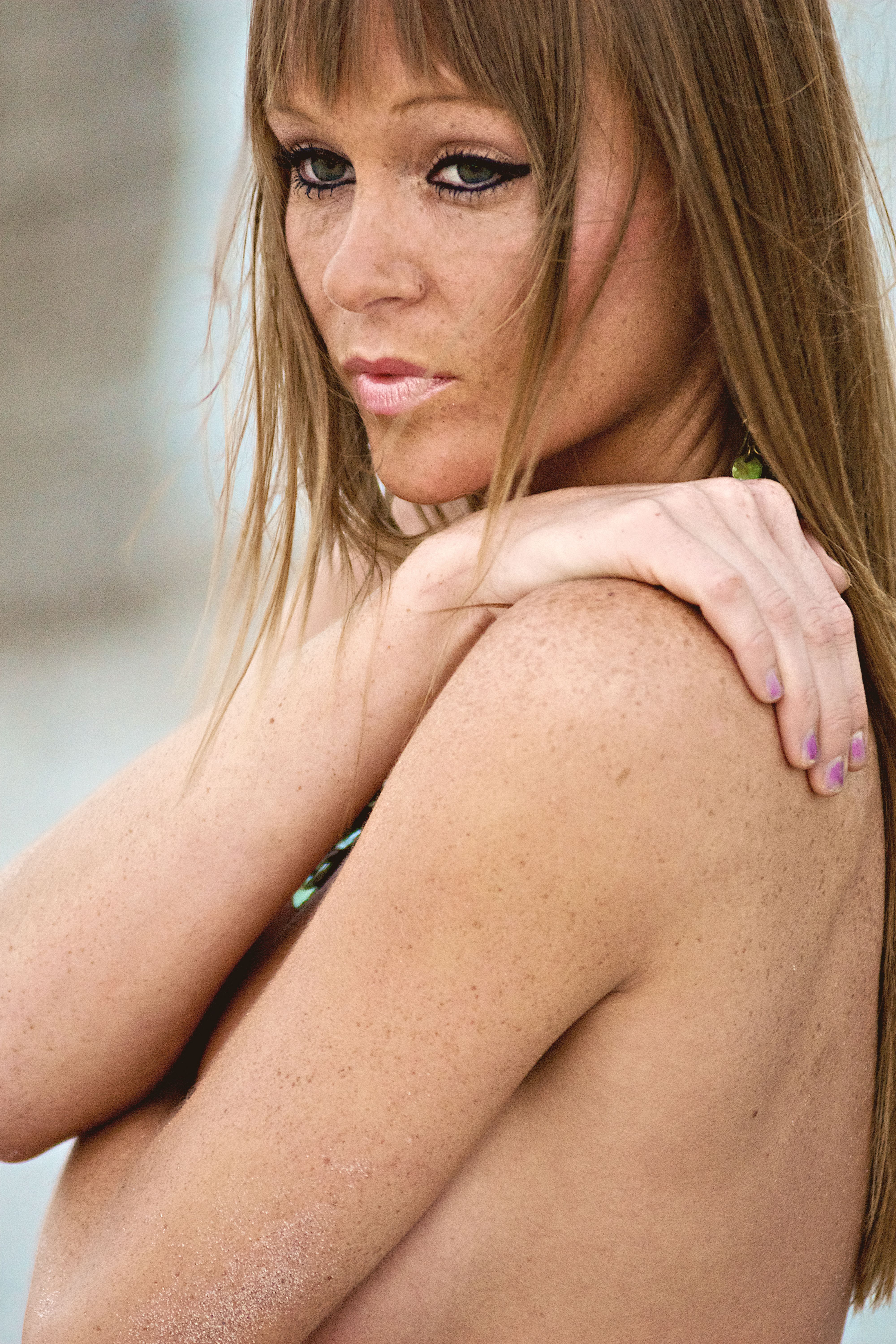 Close-up of a woman with long hair and bare shoulders on Miami Beach.