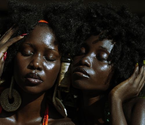 Free Close-up portrait of two women with natural hairstyles enjoying sun in Lagos. Stock Photo