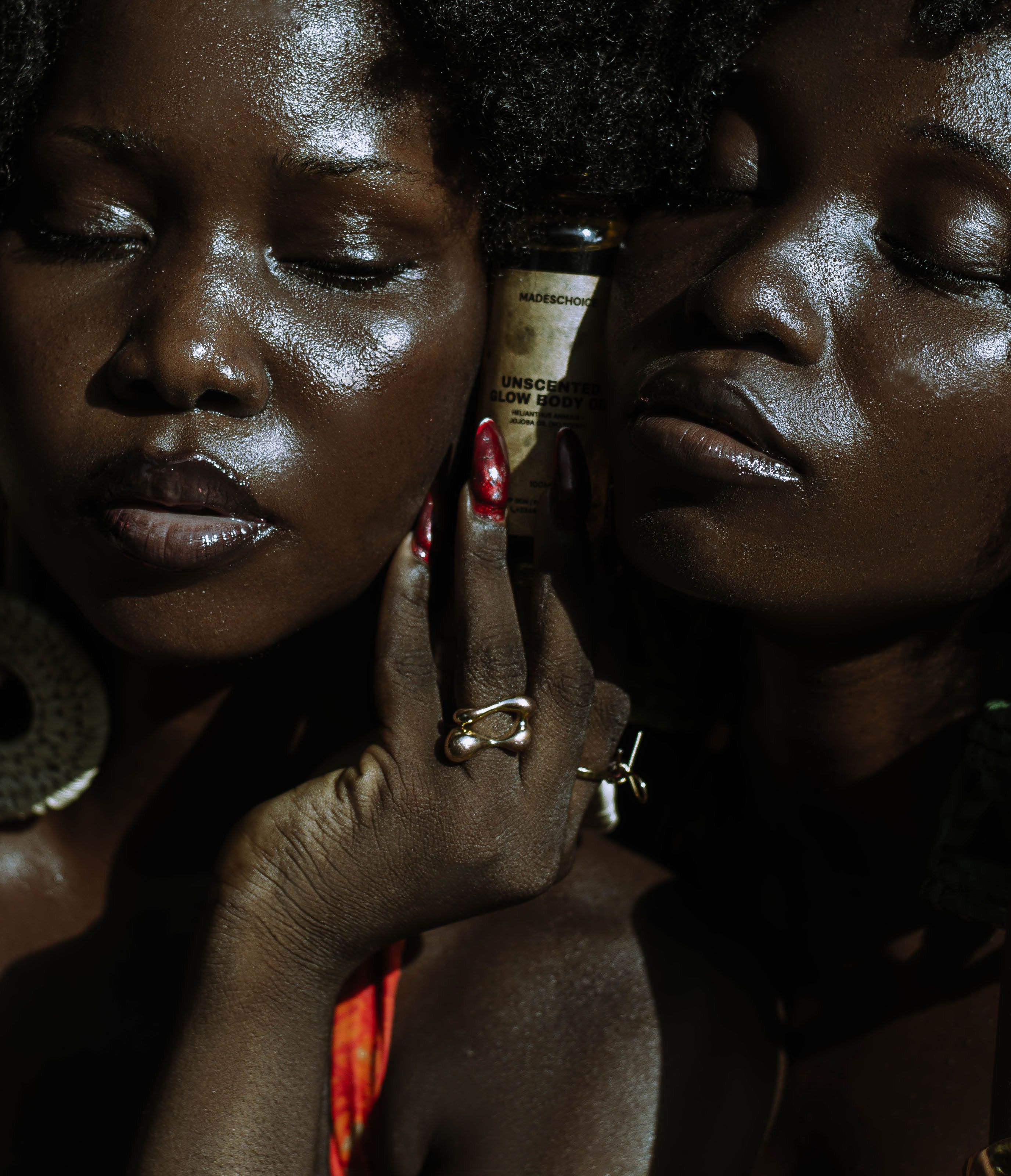 Intimate portrait of two women with glowing skin in Lagos, Nigeria.