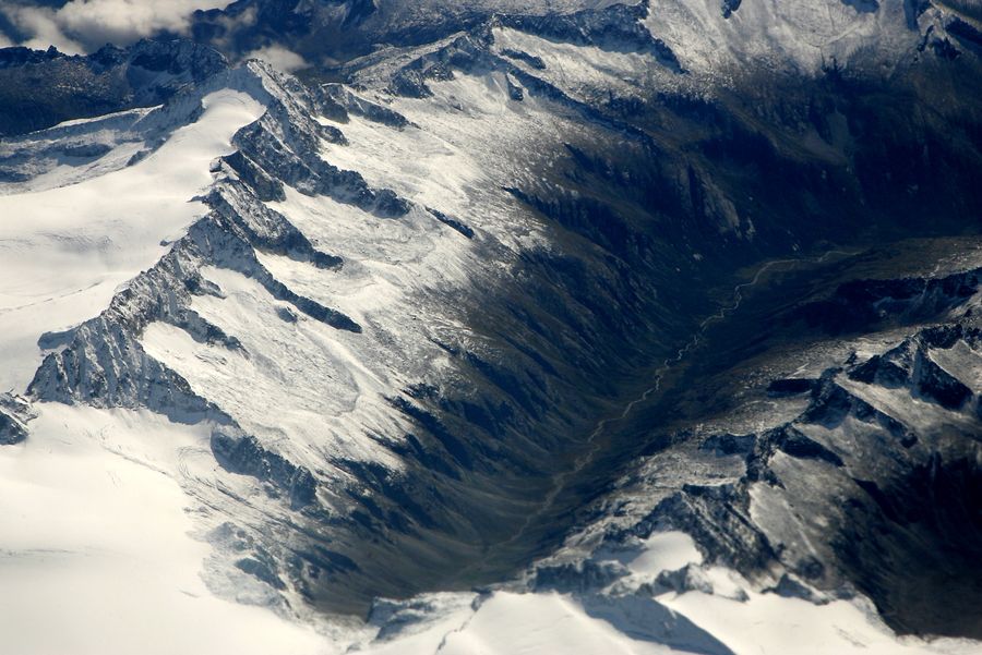 Aerial view of snow-covered mountains — photo by Aigars Jansons on Pexels