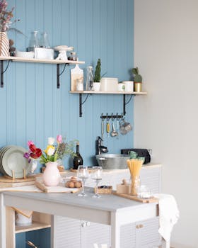 A well-organized modern kitchen featuring open shelves and vibrant decor.