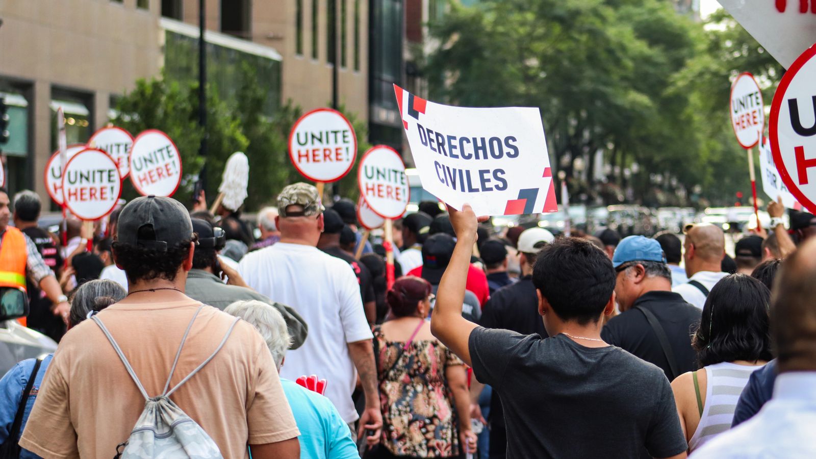 Protest in Chicago advocating for workers' rights, unity, and equality.