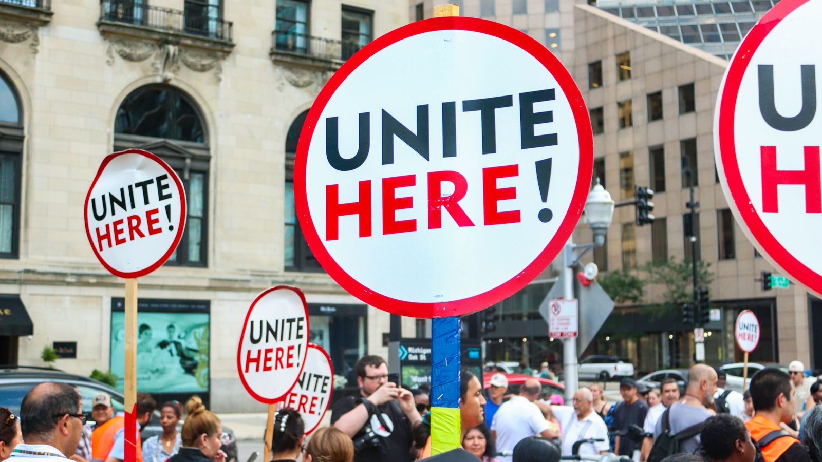 Active labor union demonstration in downtown Chicago advocating for workers' rights and unity.