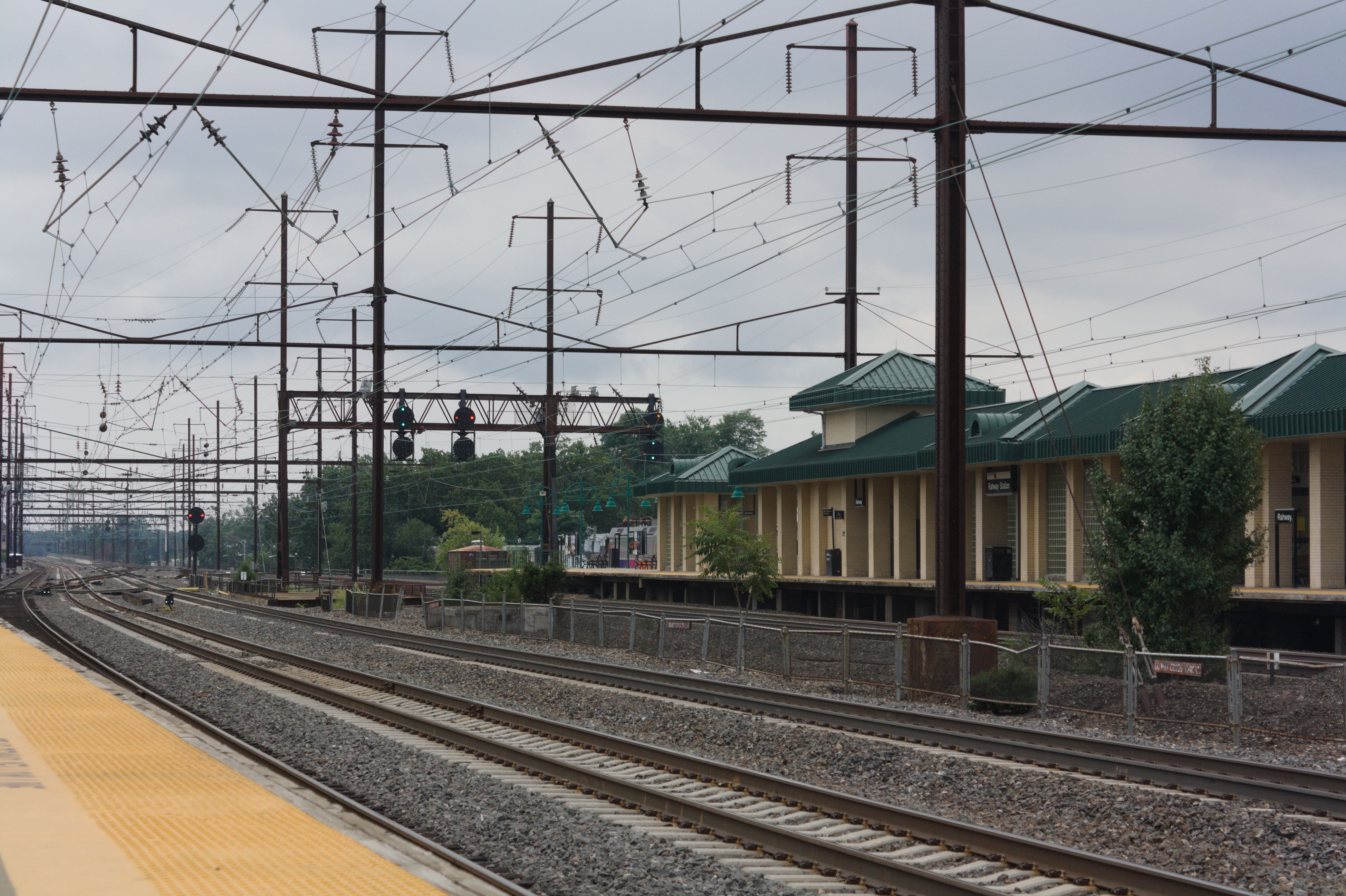 Scenic view of railroad tracks at Rahway Station, New Jersey, on a cloudy day.