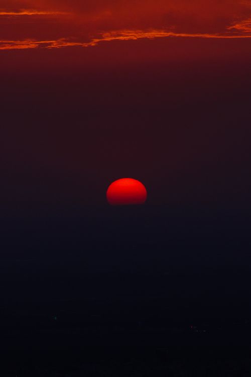 Free A vibrant red sunset over the horizon captured in Béni Mellal, Morocco. Stock Photo