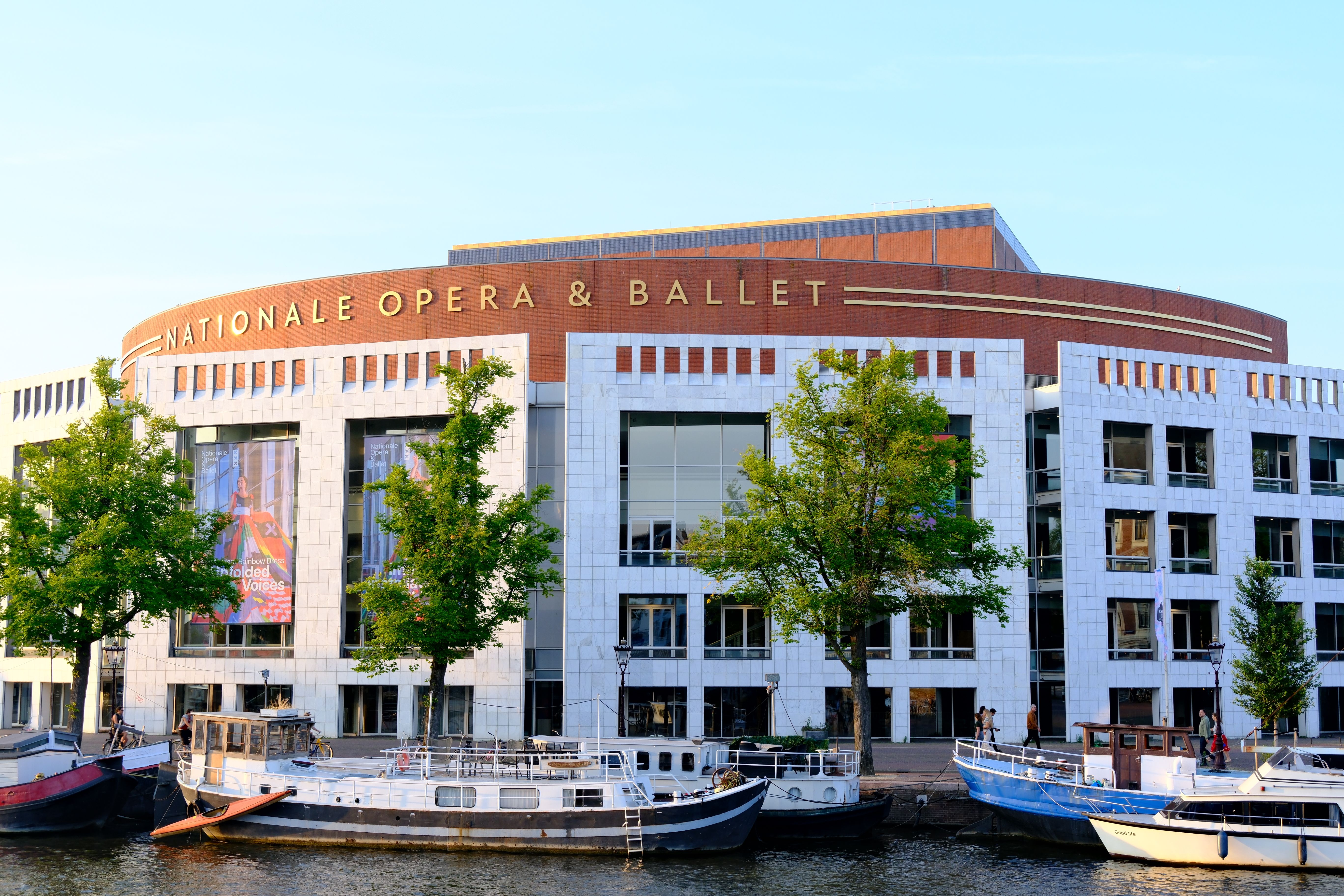 Stunning architectural shot of the Nationale Opera & Ballet in Amsterdam by the canal.
