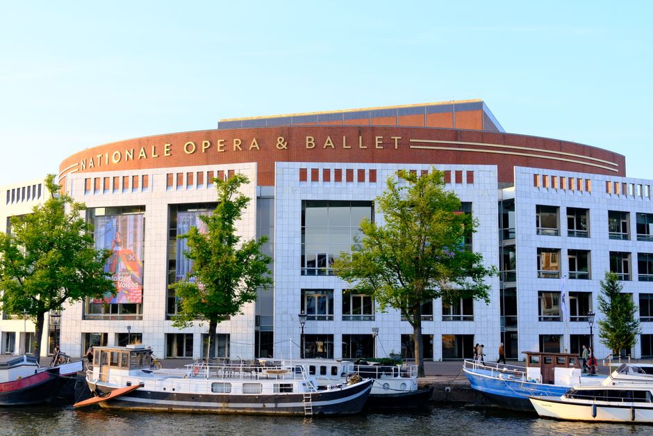 Stunning architectural shot of the Nationale Opera & Ballet in Amsterdam by the canal.