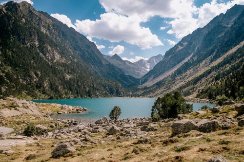 Free Breathtaking view of Gaube Lake surrounded by majestic mountains in Cauterets, Occitanie, France. Stock Photo