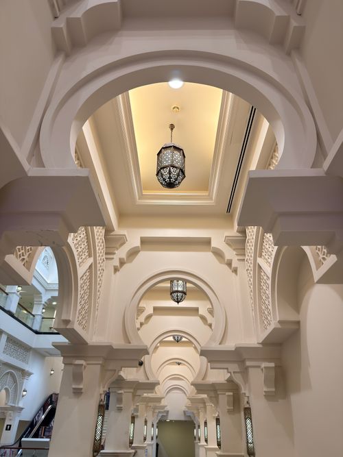 Free Interior view of stunning Islamic arches with intricate designs and elegant lighting. Stock Photo