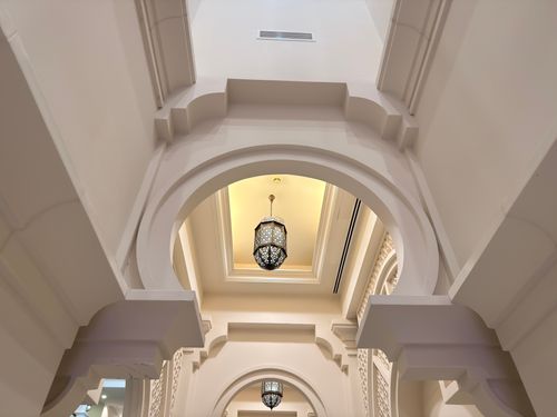 Free A stunning view of traditional Middle Eastern interior architecture with ornate arches and elegant lighting. Stock Photo