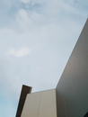 Modern building located under blue sky