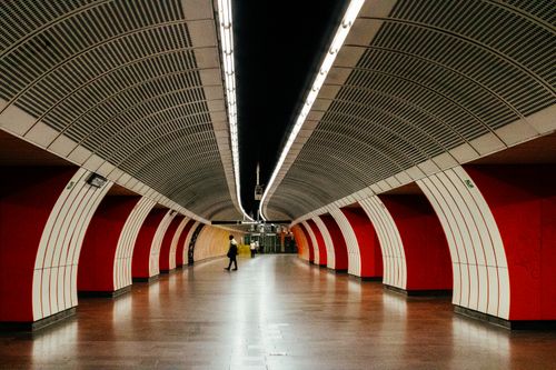 Free Symmetrical view of a modern subway station in Vienna with striking red arches. Stock Photo
