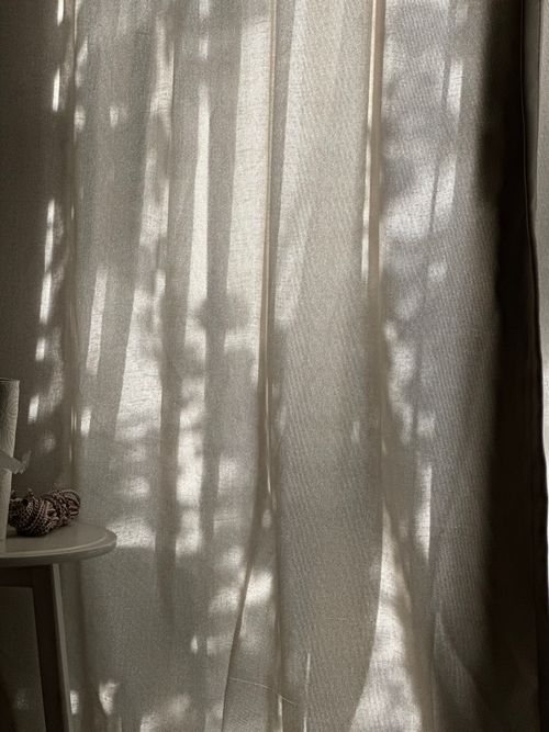 Free Gentle sunlight casting natural shadows through a curtain, creating a calm indoor atmosphere. Stock Photo