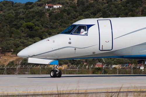 Free A private jet on the tarmac with a pilot visible in Skiathos, Greece. Stock Photo