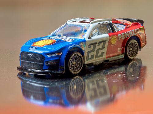 Free Close-up of a detailed scale model NASCAR car featuring a vibrant Shell-Pennzoil design. Stock Photo