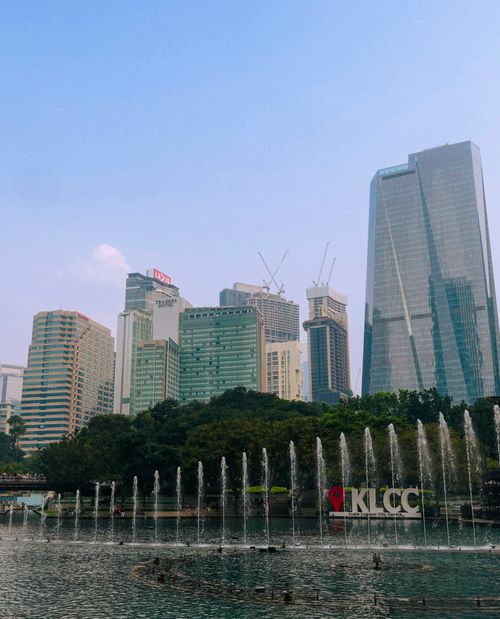 Free The impressive skyline of Kuala Lumpur City Center with fountains and skyscrapers. Stock Photo