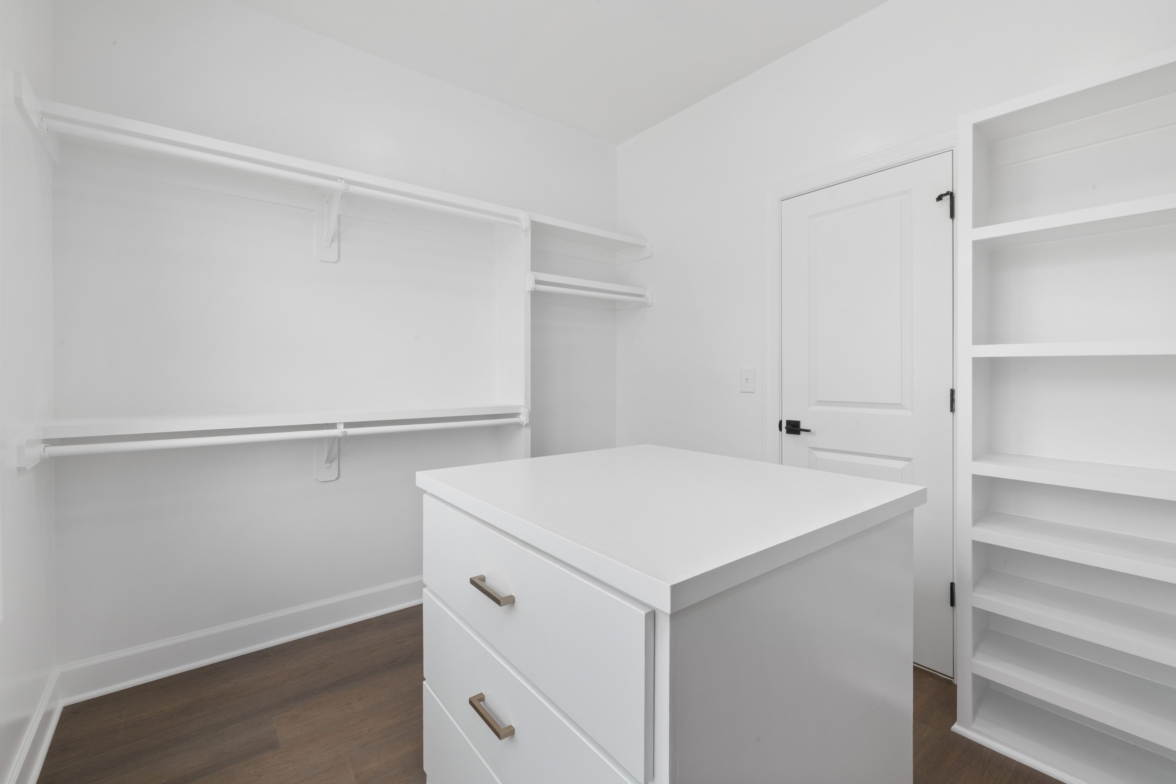 compact reach-in closet system with adjustable shelving