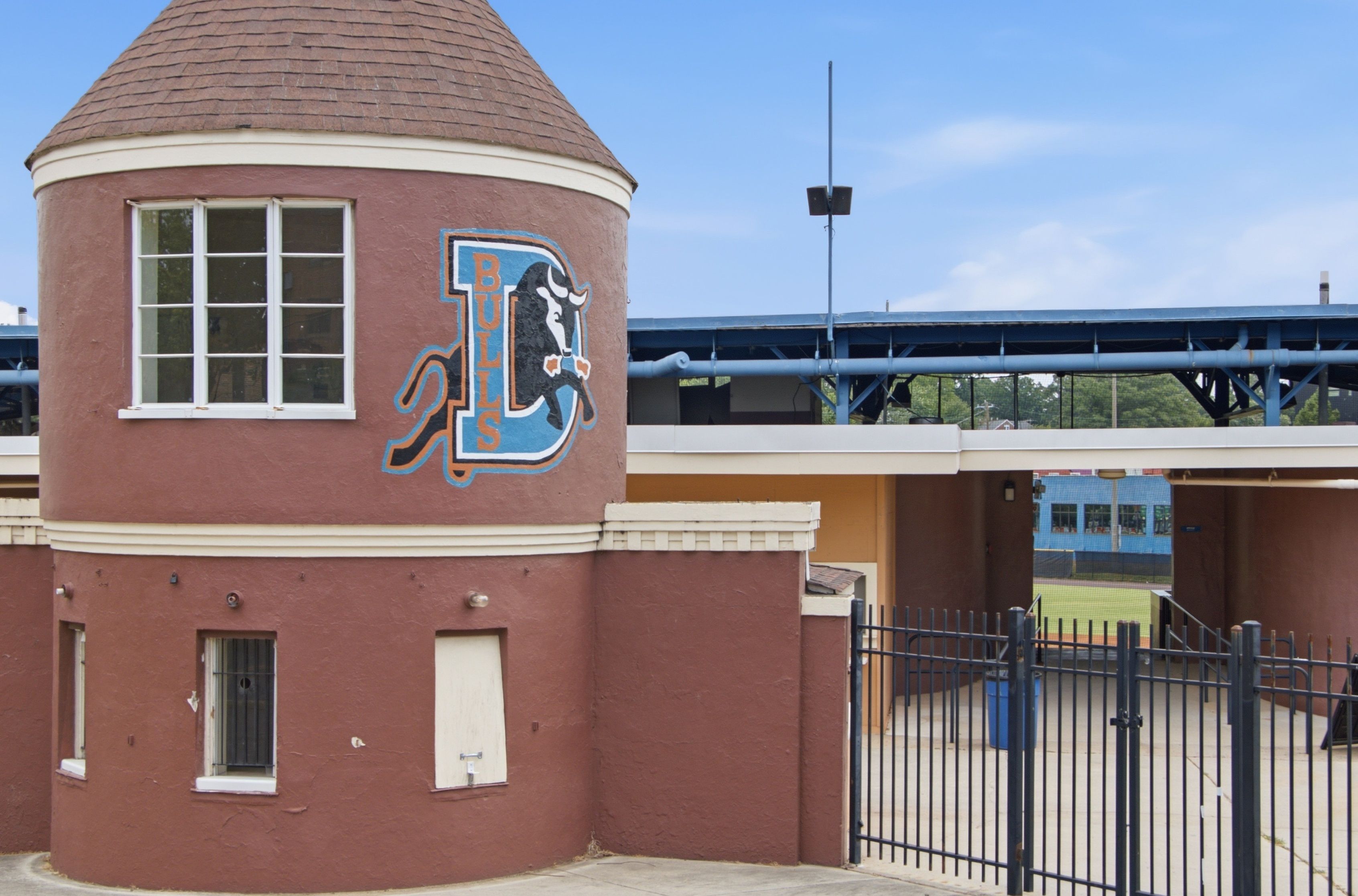 Entrance building of the Durham Bulls Athletic Park, featuring the team logo.