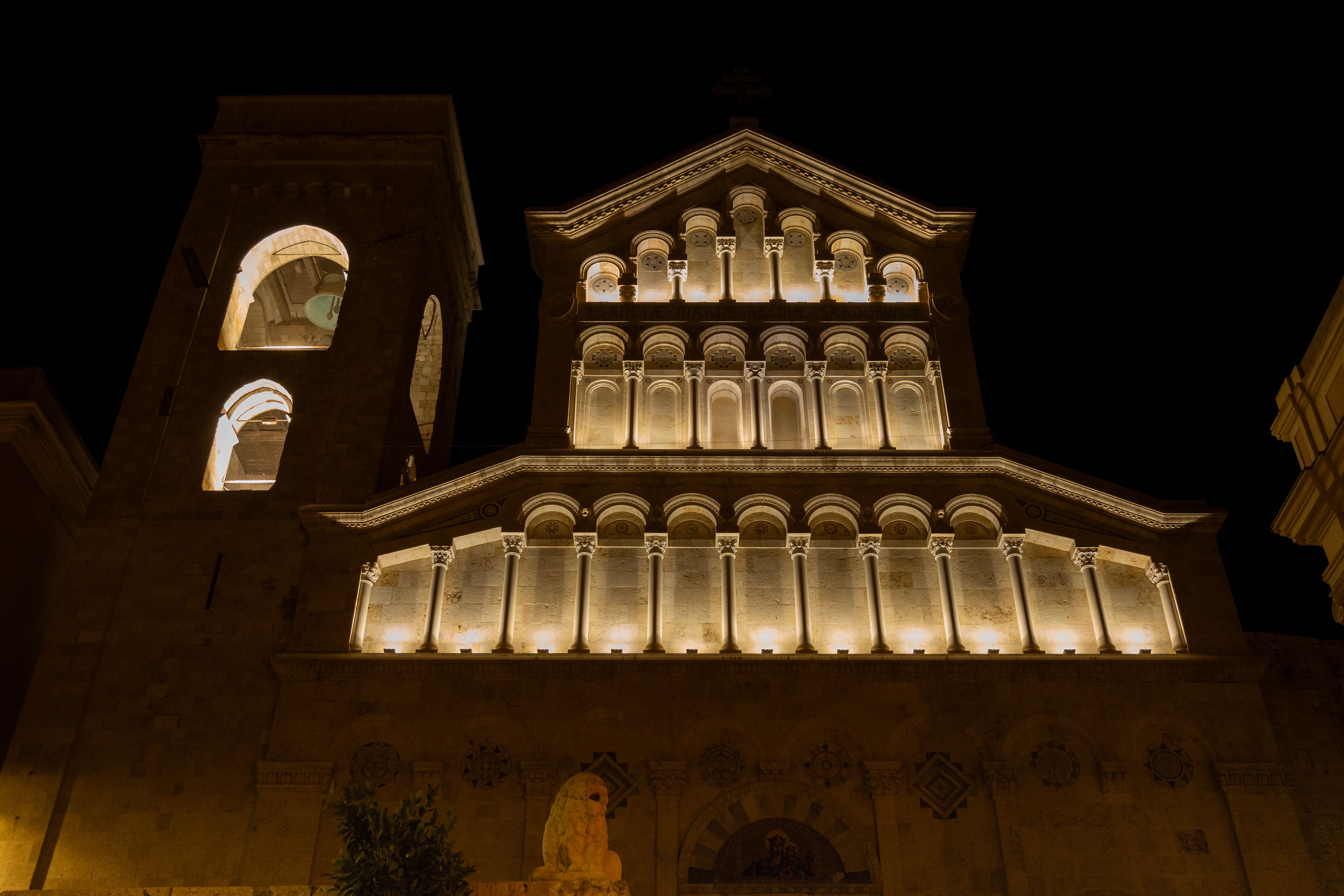 Majestic facade of Cagliari Cathedral beautifully lit up against a night sky.
