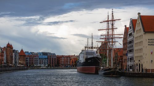 Free Scenic view of Gdańsk's waterfront with historical ships and architecture. Stock Photo