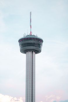 A view of the Tower of the Americas in San Antonio with a clear sky background.