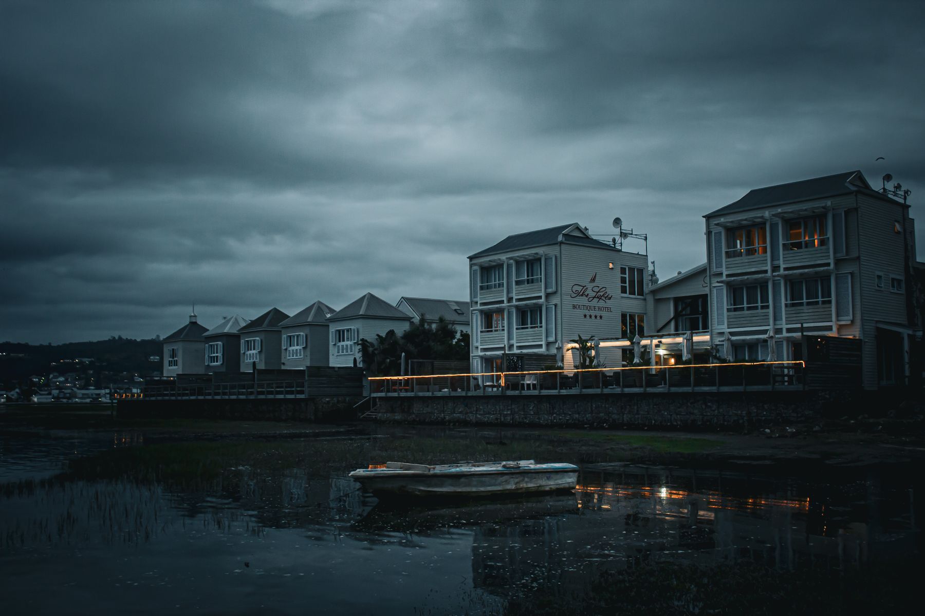 Waterfront hotel glowing at dusk