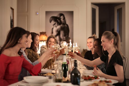 Free Group of People Sitting on Dining Table Stock Photo