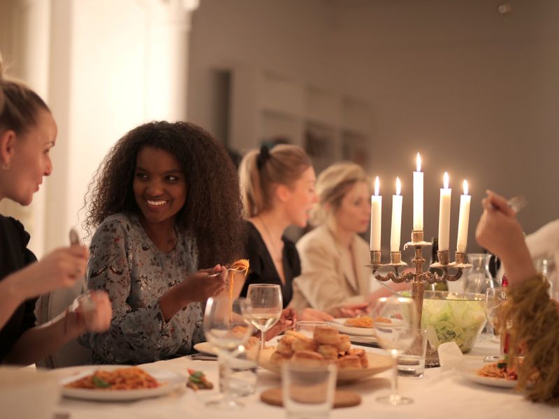 Friends enjoying a candlelit dinner together