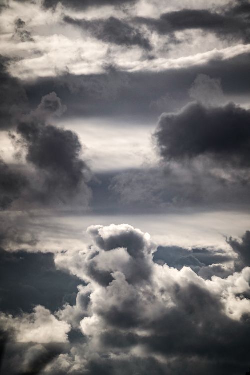 Free Moody and dramatic sky filled with dark clouds, evoking a sense of impending storm. Stock Photo