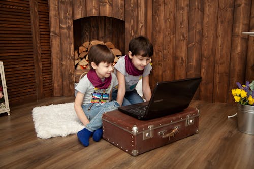 Boys Looking At Laptop Screen