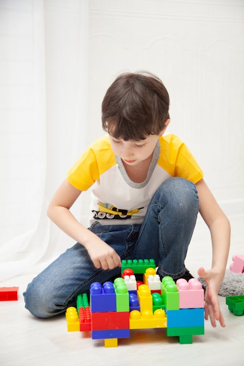 Free Boy Playing With Building Blocks Stock Photo