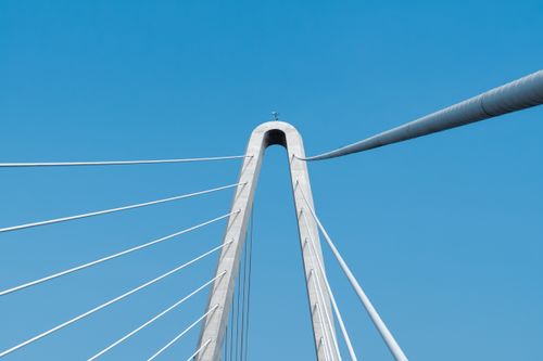 Free A stunning view of a modern cable-stayed bridge against a bright blue sky in Ho Chi Minh City. Stock Photo